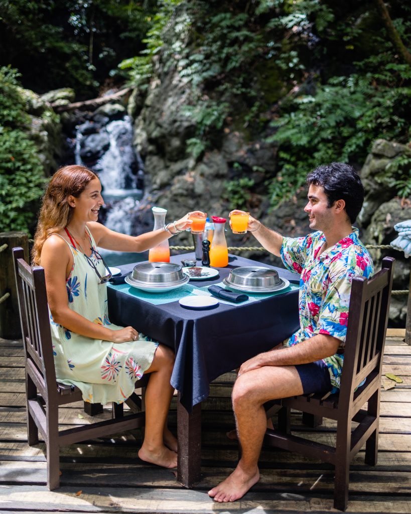 couple enjoying a meal at namale resort & spa waterfall